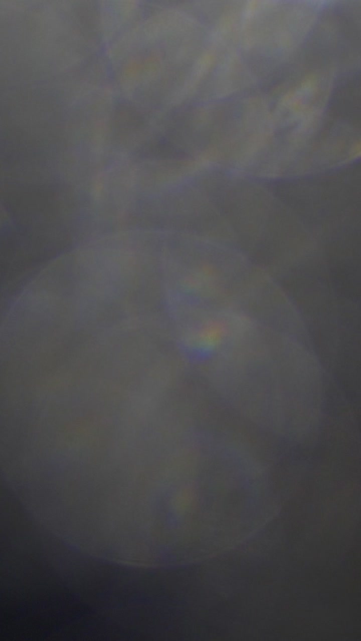 Abstract Light Leaks and Lens Flares on Dark Background
