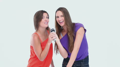 friends singing at karaoke