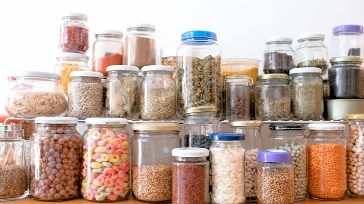 Jars of spices and cereals on kitchen counter, truck shot