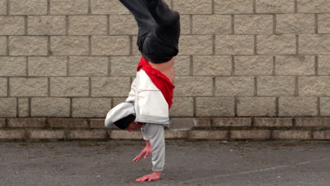 cool young break dancer doing a handstand