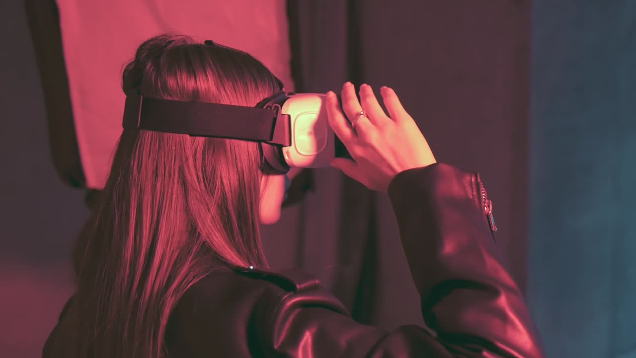 Model with a virtual reality head set is photographed