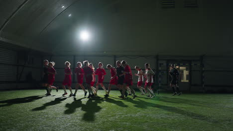 a group of women playing soccer indoors