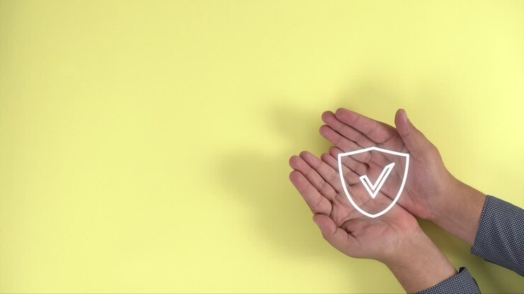 hands together show protection shield on yellow background