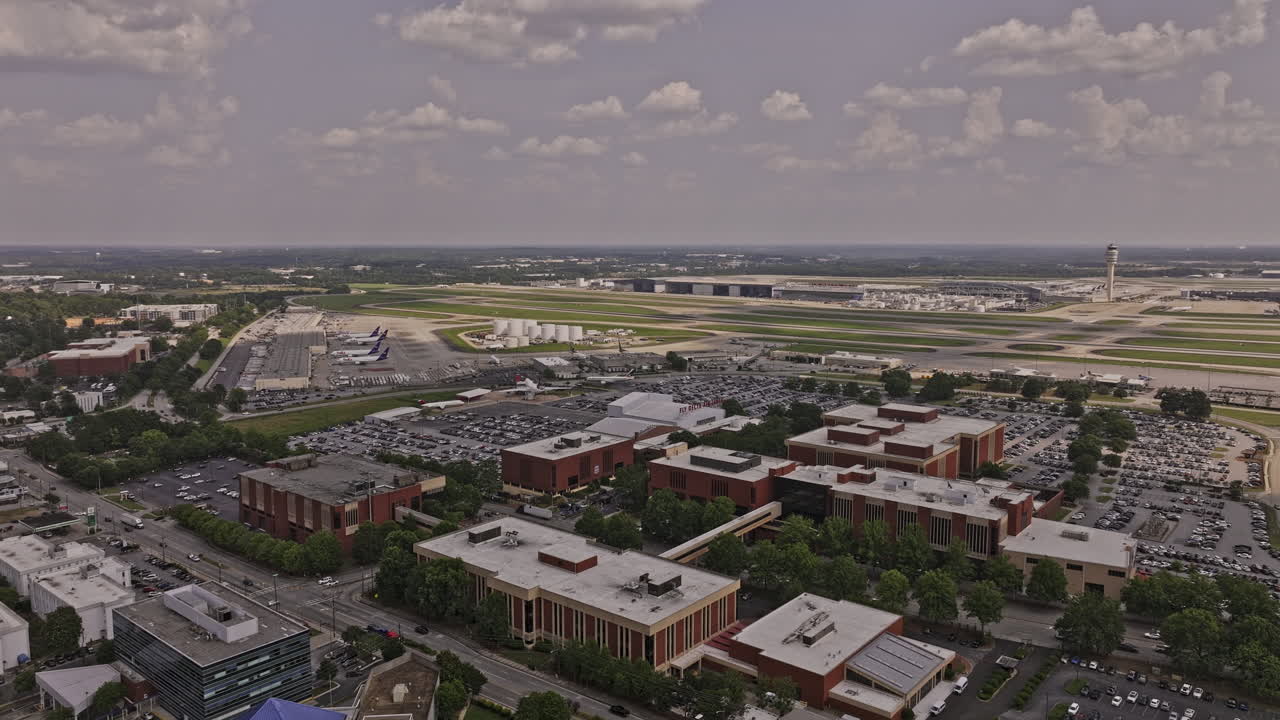 Atlanta Georgia Aerial v958 drone flyover ATL Hartsfield-Jackson International airport capturing concourse, FAA air traffic control tower and Delta headquarter - Shot with Mavic 3 Pro Cine - June 2023