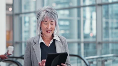 Escalator,-tablet-and-mature-businesswoman