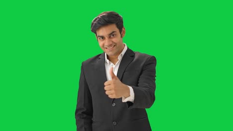 Happy-Indian-businessman-showing-thumbs-up-sign-Green-screen