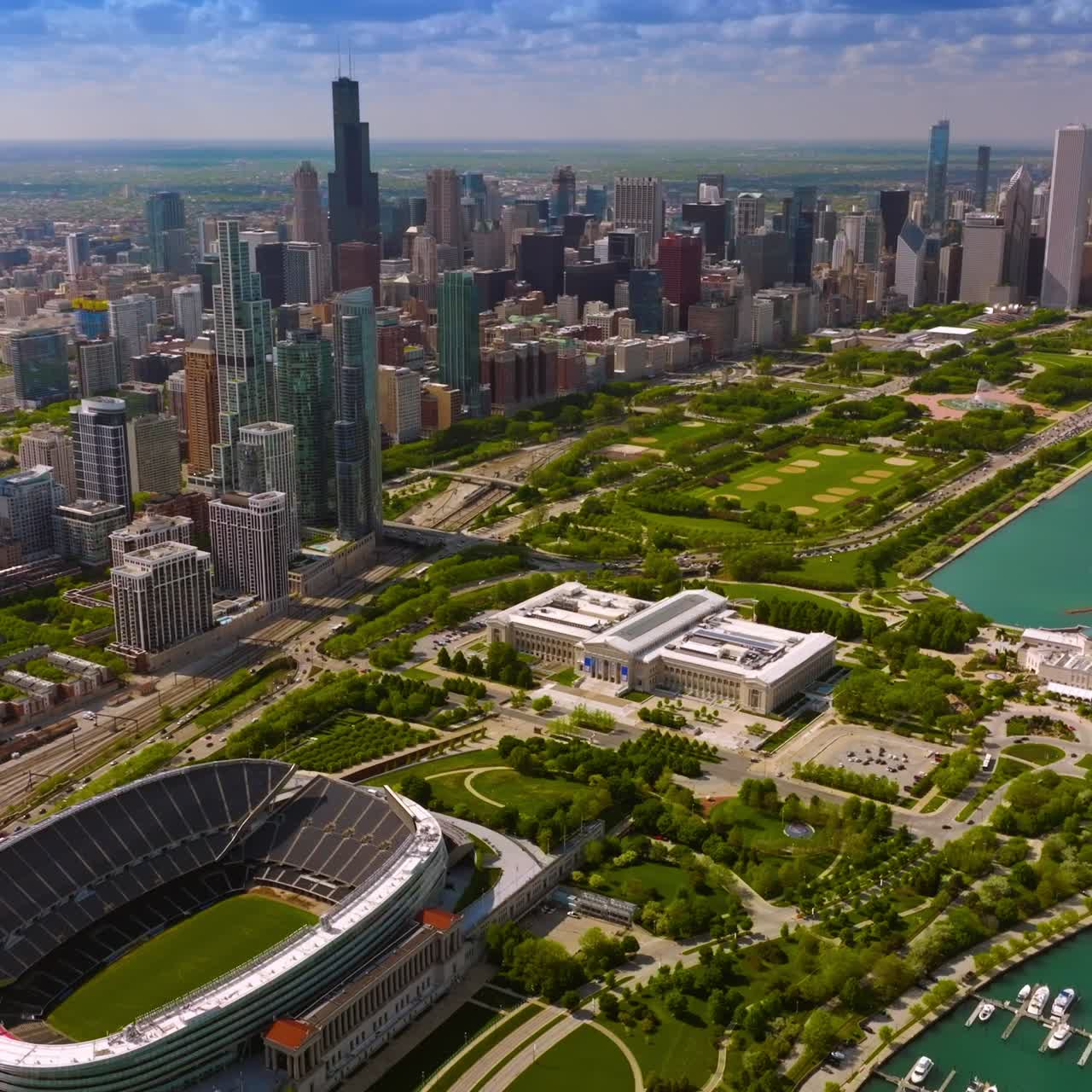 Fascinating panorama of Chicago downtown. Yacht club, Soldier Field Stadium and green park at the backdrop of skyscrapers