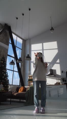 woman using vr headset in a modern home during the holidays