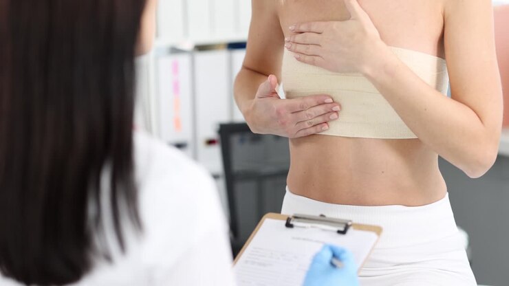 Woman with chest bandage consulting a doctor