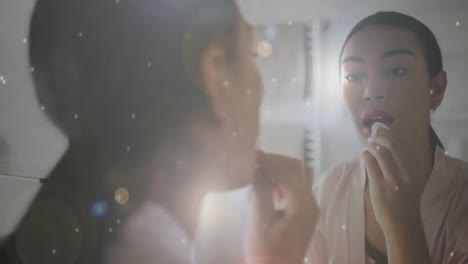 animation of light spots over biracial woman applying lipstick