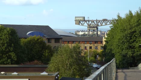 Glasgow's-Finnieston-Crane-from-afar-with-blue-sky,-Static-shot