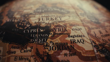 close-up of a vintage world globe, focusing on the middle east