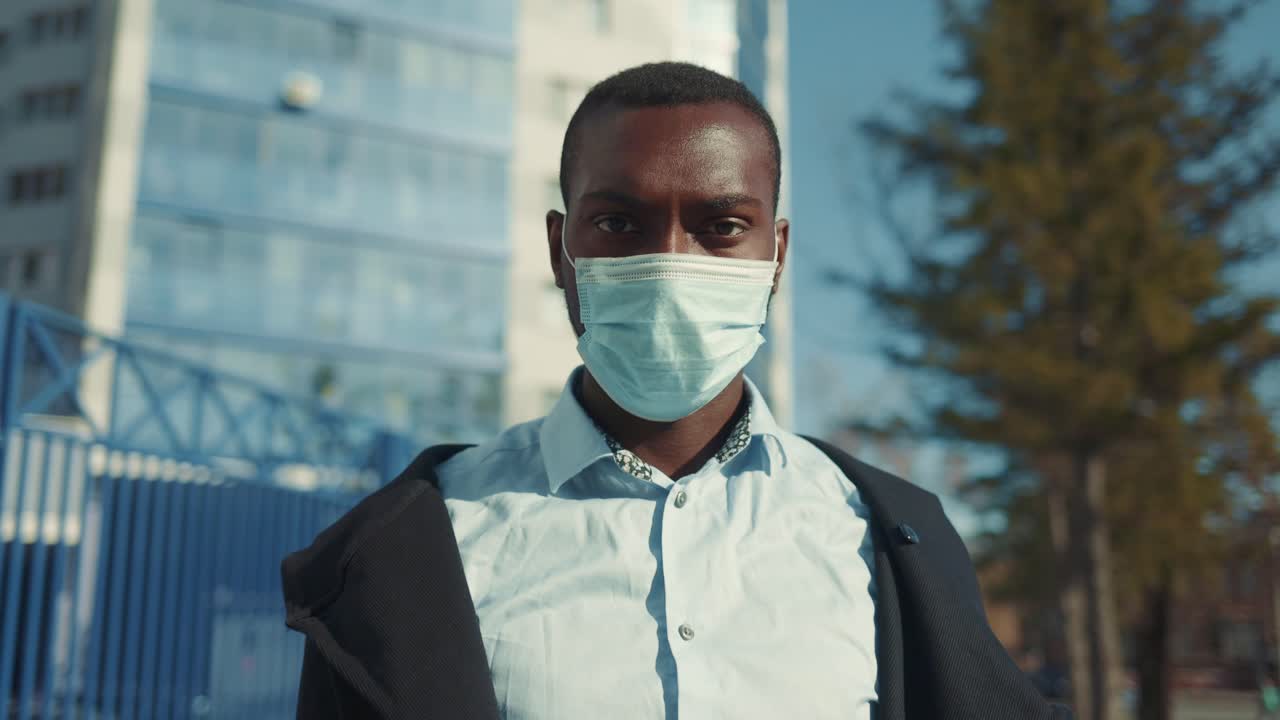 Man Wearing a Mask in the City