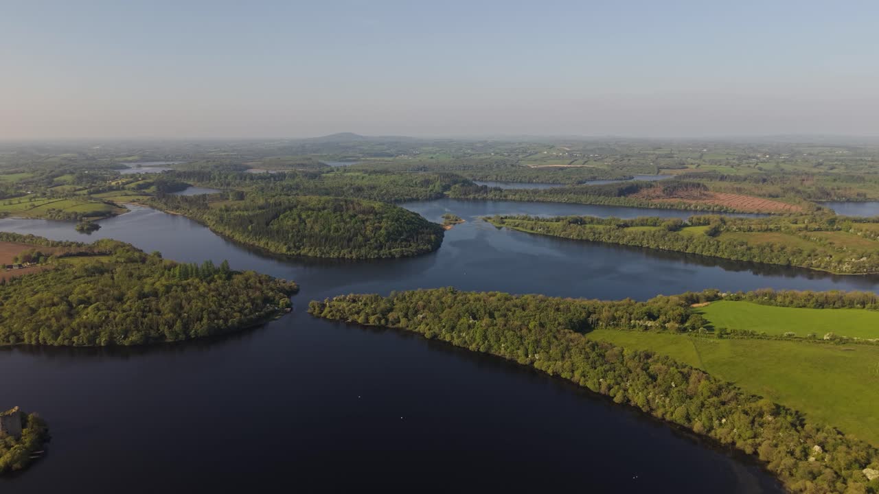Lough Oughter Castle Island - Panoramic View Of Green Landscape And Lake With Cloughoughter Castle In Ireland. - aerial shot