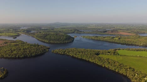 lough oughter castle island - panoramic view of green landscape and lake with cloughoughter castle in ireland. - aerial shot