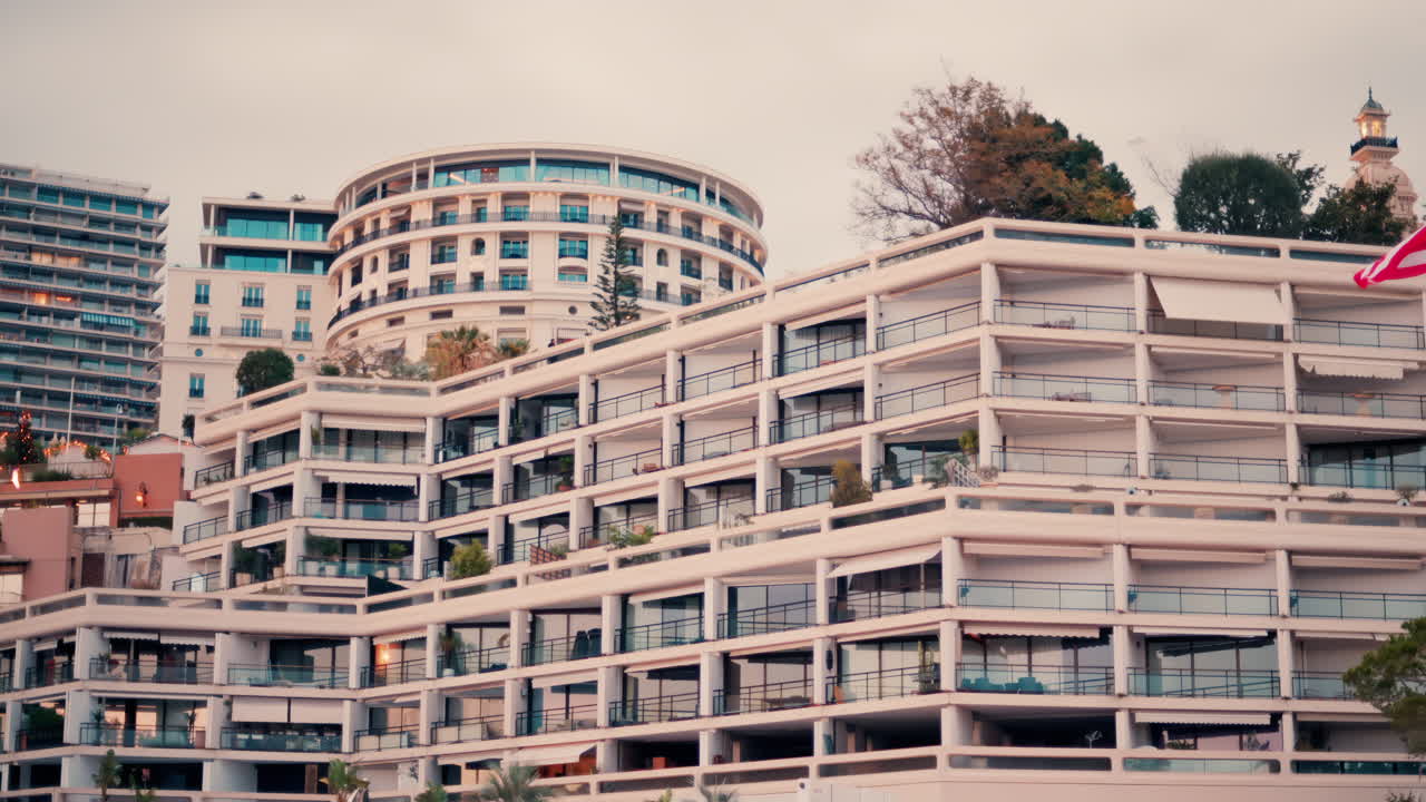 La Condamine, Monaco - November 4, 2024: View of boats docked in the Monaco Marina with the skyline of the city on the background