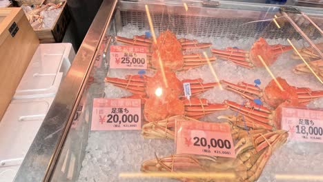 various seafood items with price tags on ice