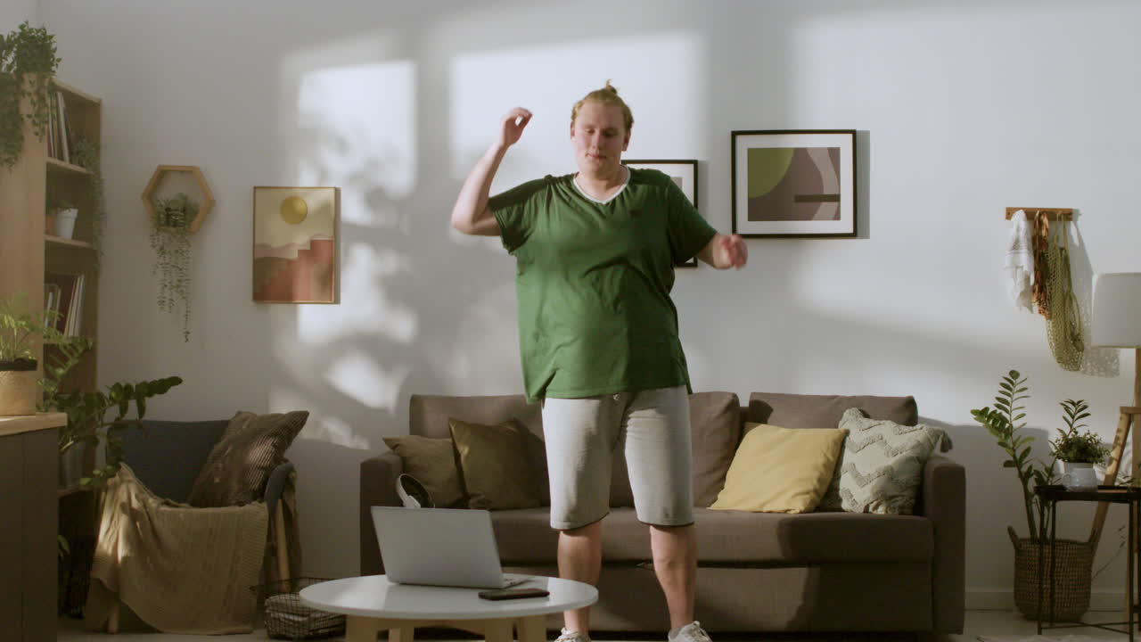 Young guy stretching at home