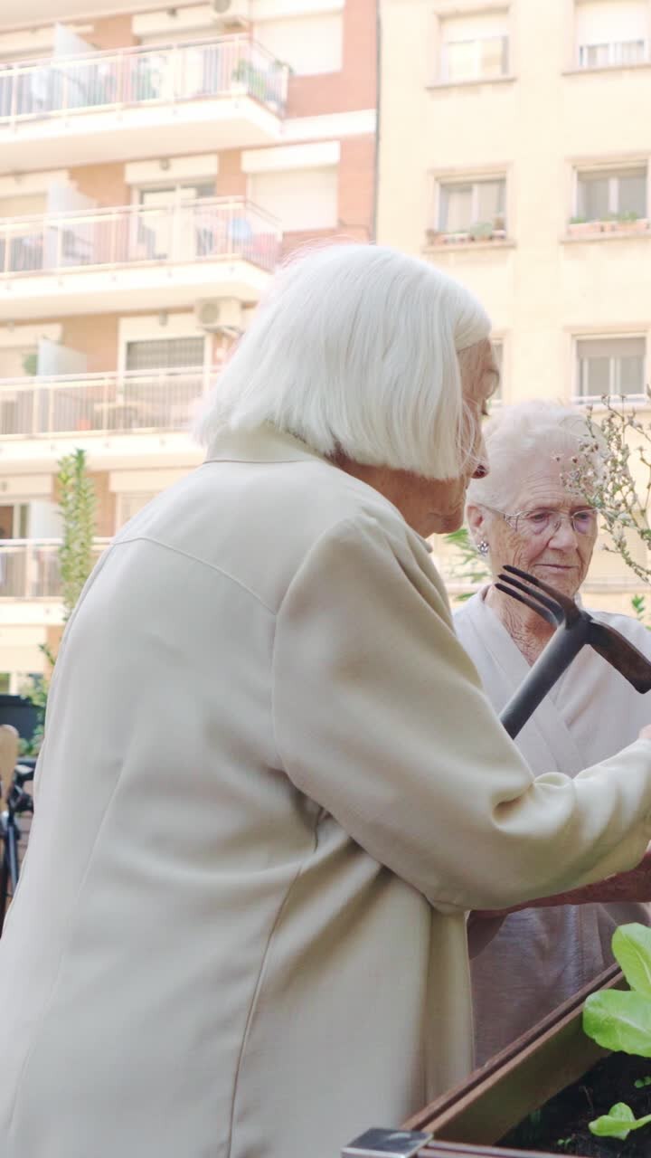 Elderly women gardening on a balcony