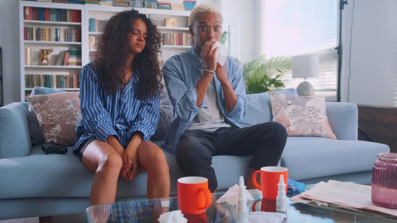 Multiracial couple indian woman and african american man have flu or cold wipe