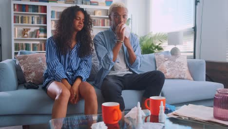 multiracial couple indian woman and african american man have flu or cold wipe