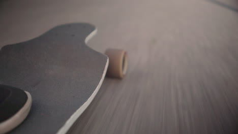 close up low angle of longboard and wheels