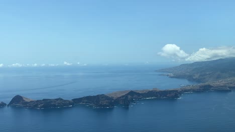 arriving by airplane to funchal, madeira island , as seen by the pilots, to runway 23 in a splendid summer afternoon