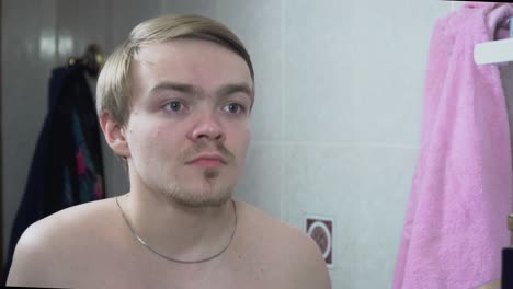 man grooming in bathroom