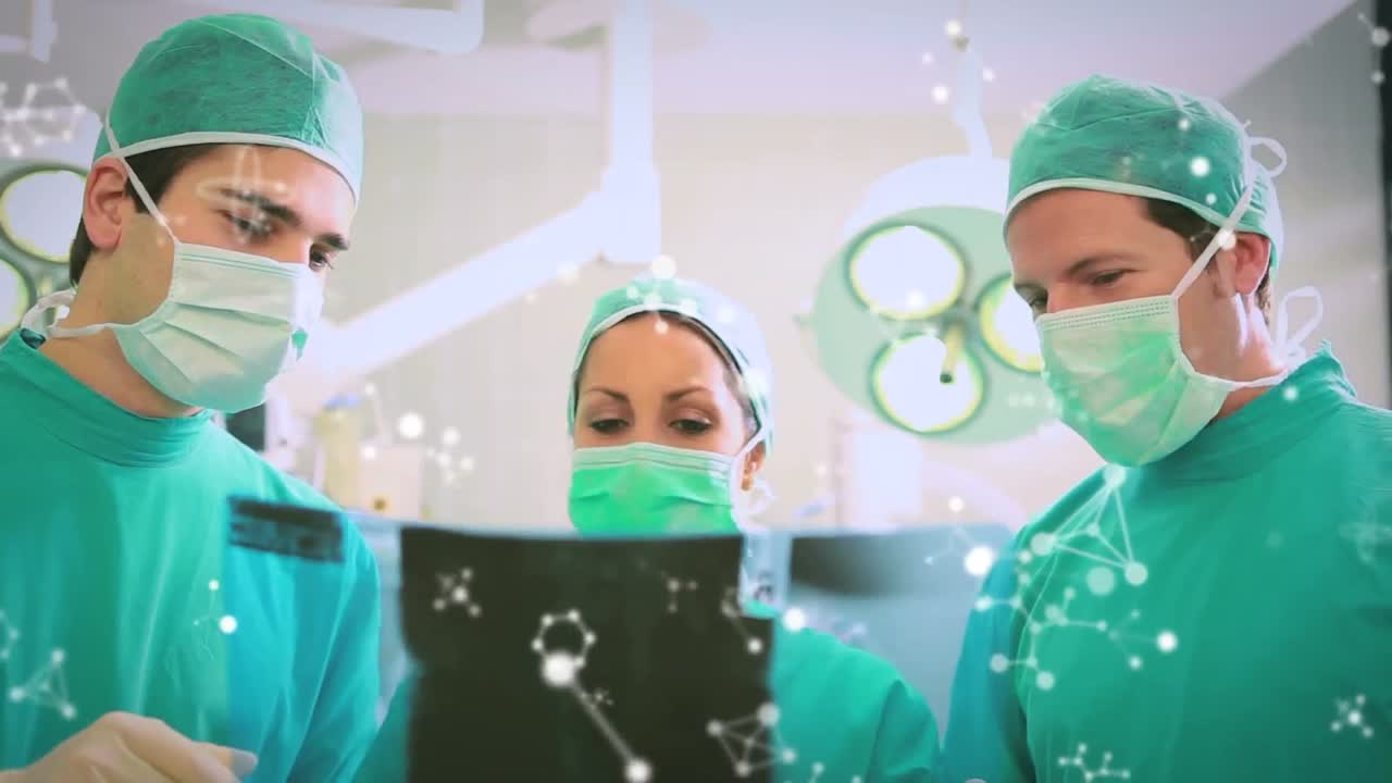 백인 남성과 여성 외과의사 그룹에 대한 분자의 애니메이션  ⁇ 스레이 사진