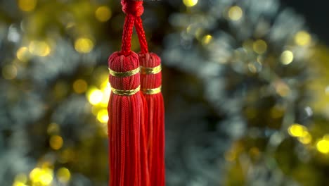 dreamy chinese new year symbol ornament, oriental decoration, traditional red hanging lantern ball, colorful and glowing depth of field, smooth close-up cinematic tilt up shot 4k video