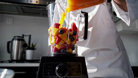 chef preparing a fruit smoothie