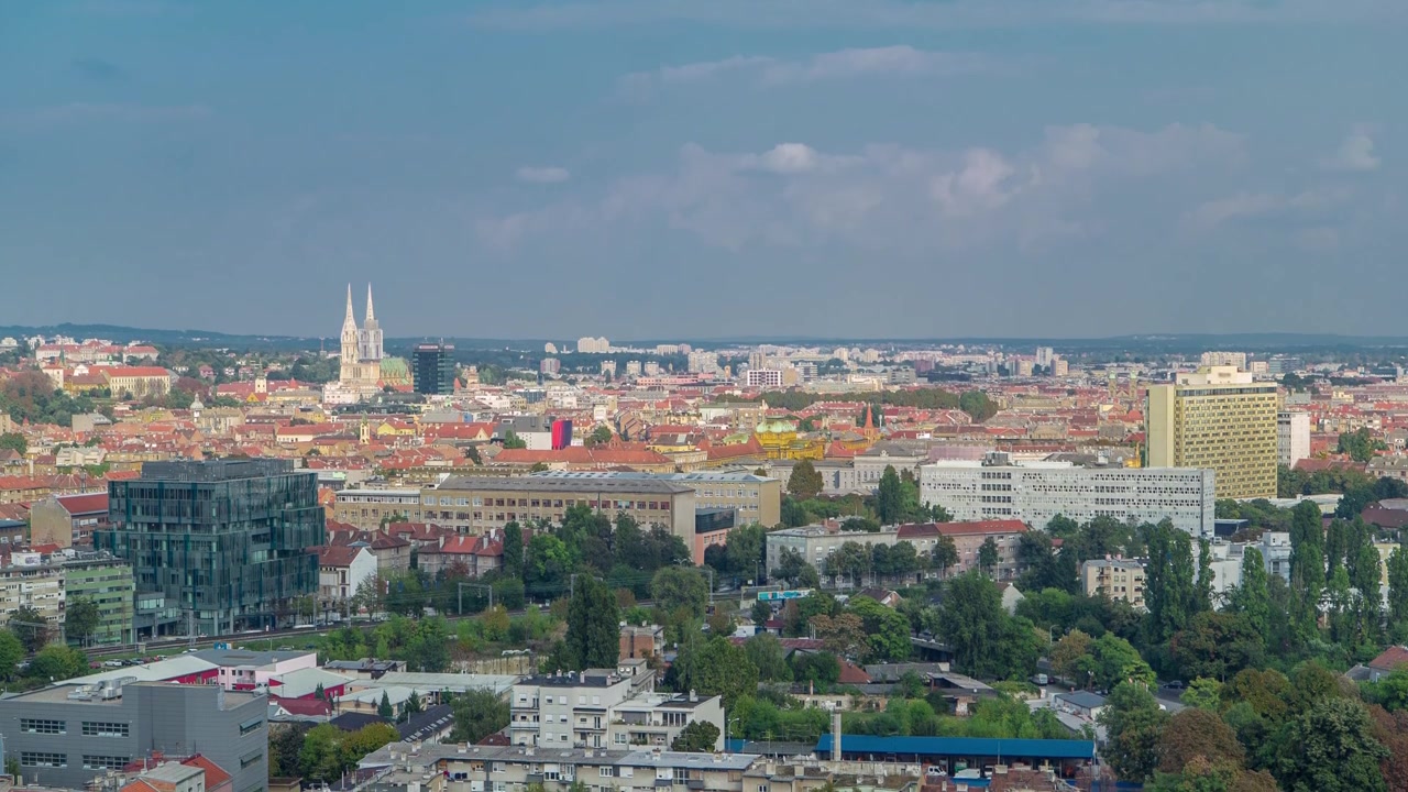 Panorama of the city center timelapse, Zagreb capital of Croatia,, with modern and historic buildings, museums in the distance. Top view from skyscraper