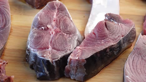 fresh tuna slices on a wooden board