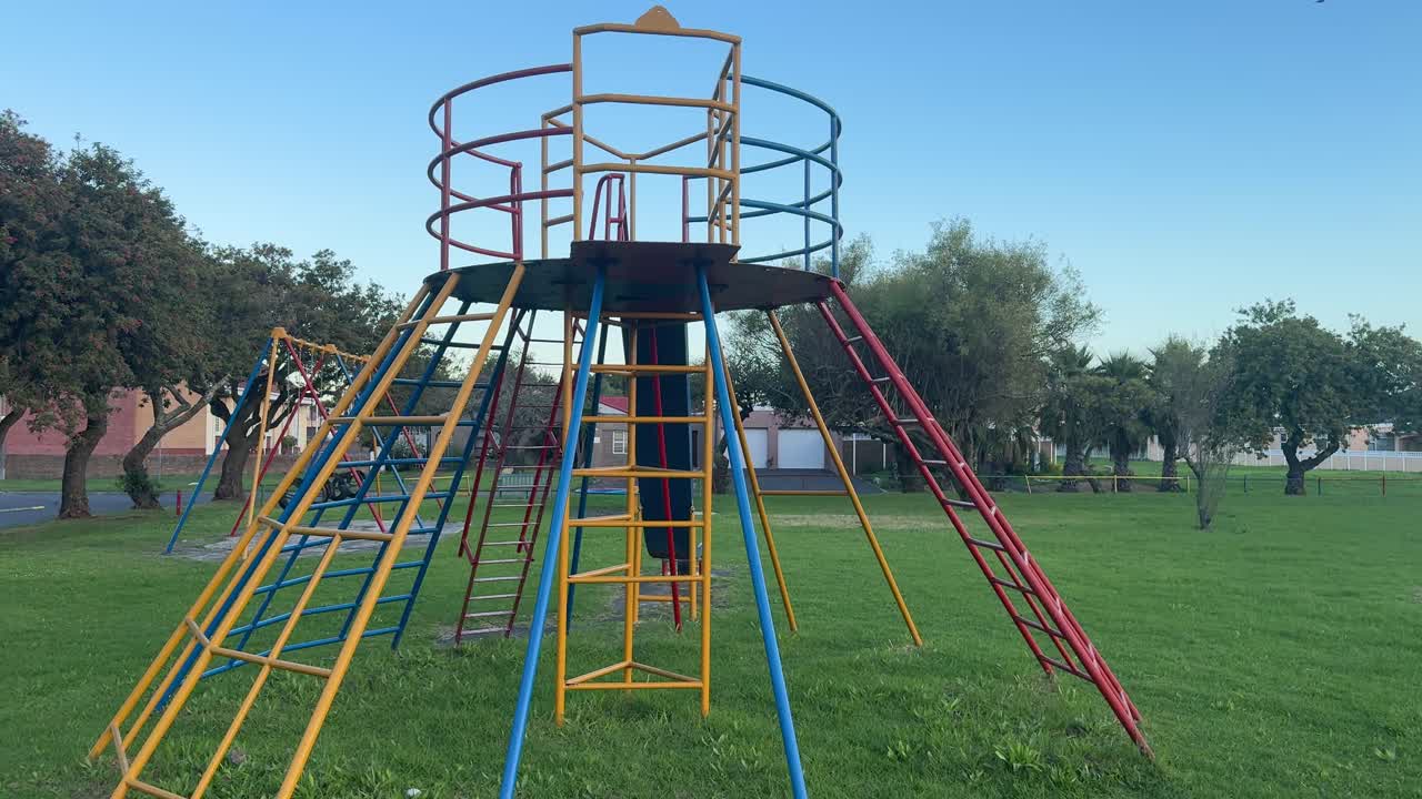 A park in Cape Town, South Africa, showing a slippery slide and jungle Jim.