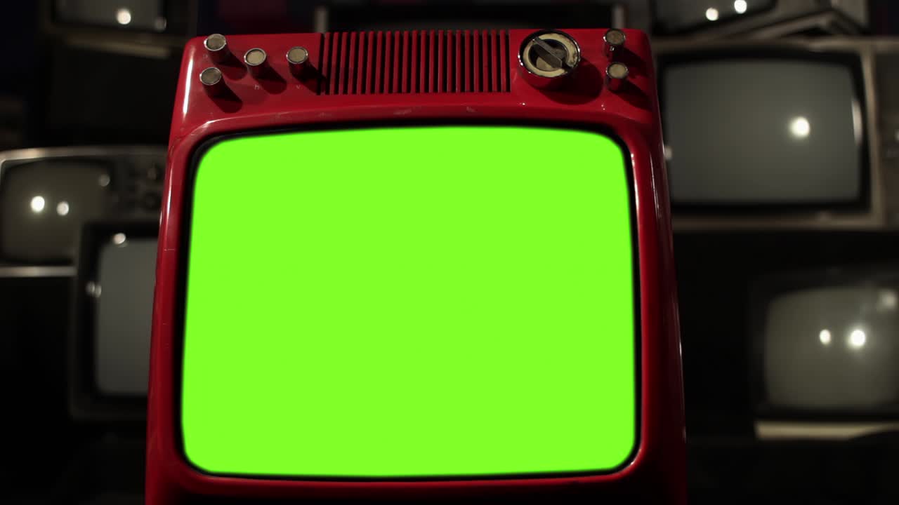 Red Television Set with Green Screen over Retro Televisions. 4K Resolution.