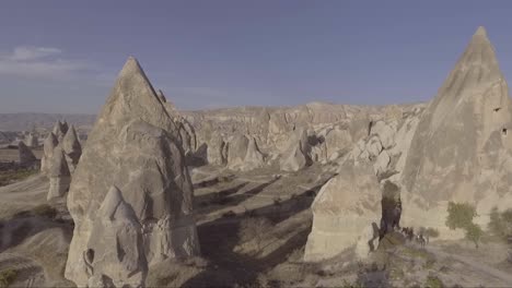 Aerial-of-tourists-riding-horses-horseback-riding-at-Cappadocia-Turkey-1