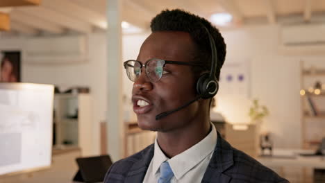 African-man,-call-center-and-night-in-office