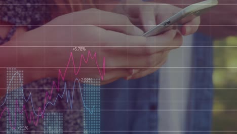 Animation-of-graphs-over-hands-of-caucasian-people-using-smartphones