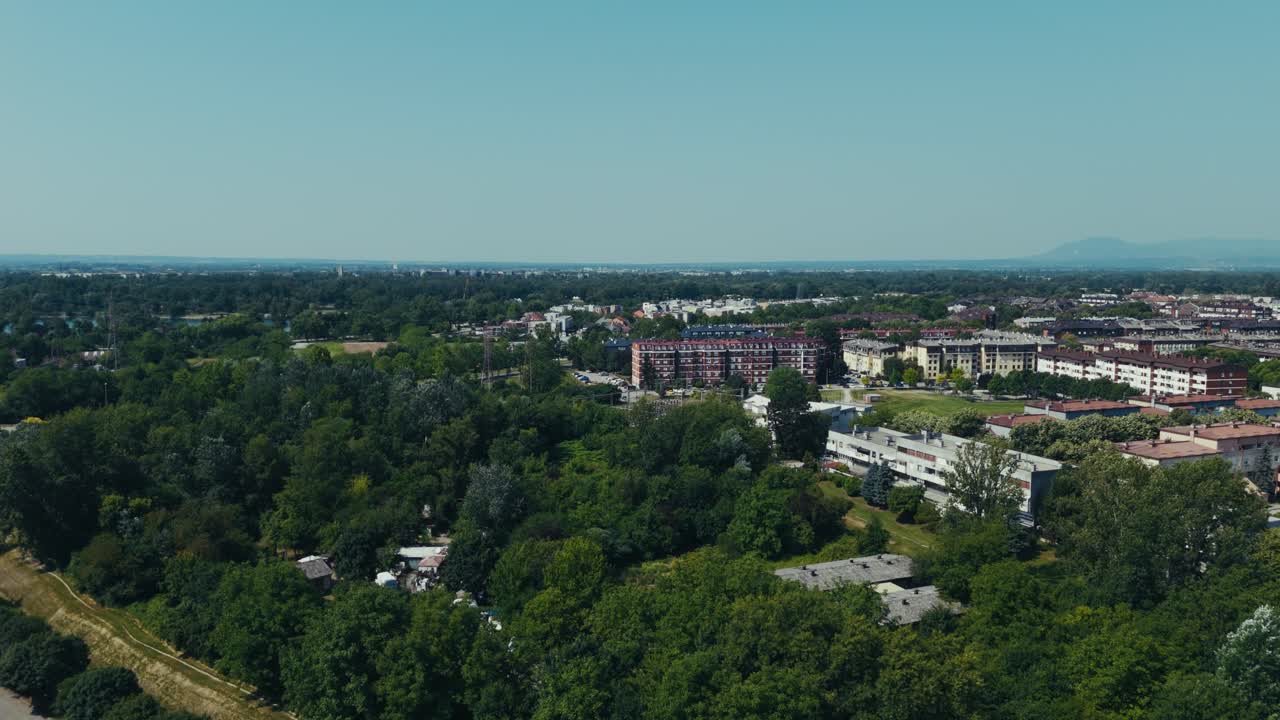 lush Jarun and Zagreb skyline over Sava River valley in bright summer sunlight