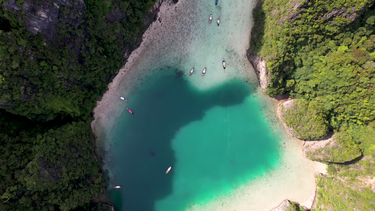 Aerial top-down drone view of Phi Phi Leh, Pileh Lagoon, Krabi province, Thailand. Amazing tropical island with clear turquoise water during a low tide , famous travel destination.