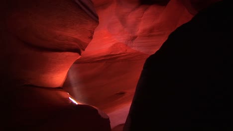 mediumshot of a light beam illuminating an interior space in antelope canyon arizona 1