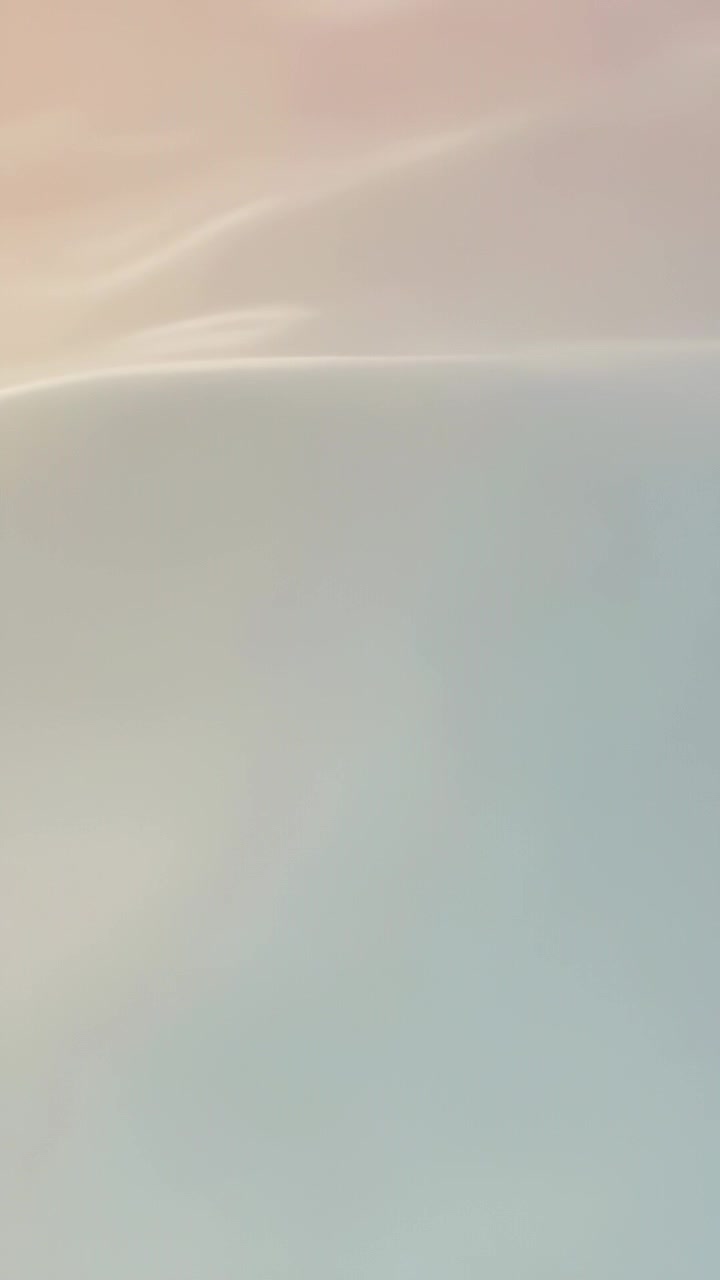 Vertical video: Starting playback, pastel gradient shifting upward on screen for calming background