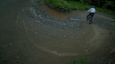 mountain biker does a drift in a corner