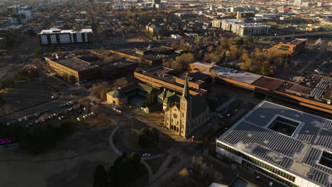 gothic-style church standing out in denver aerial