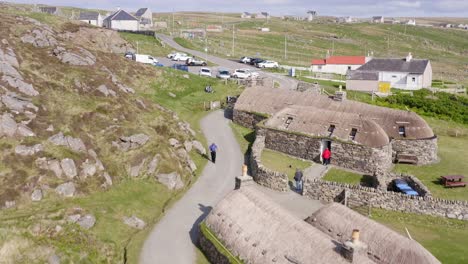 close-up drone shot of the gearrannan blackhouse village on the isle of lewis, part of the outer hebrides of scotland