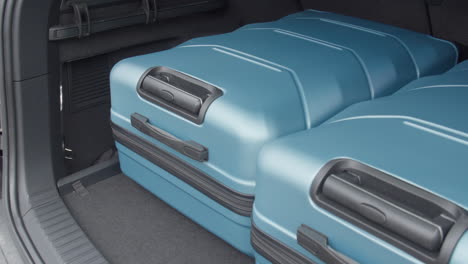 travel and camping luggage packed in the car trunk