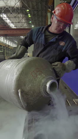 industrial worker transferring liquid nitrogen