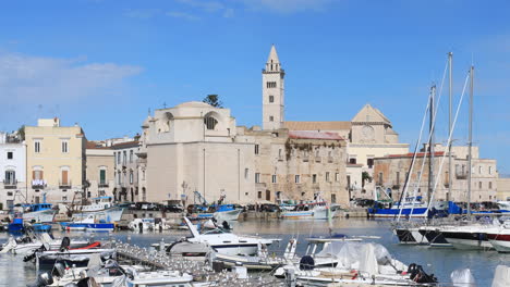 Looking across the port of Trani towards the cathedral. Dediated to Saint Nicholas the Pilgrim, Trani cathedral was consecrated in 1143 and is a fine example of Apulian Romanesque architecture.