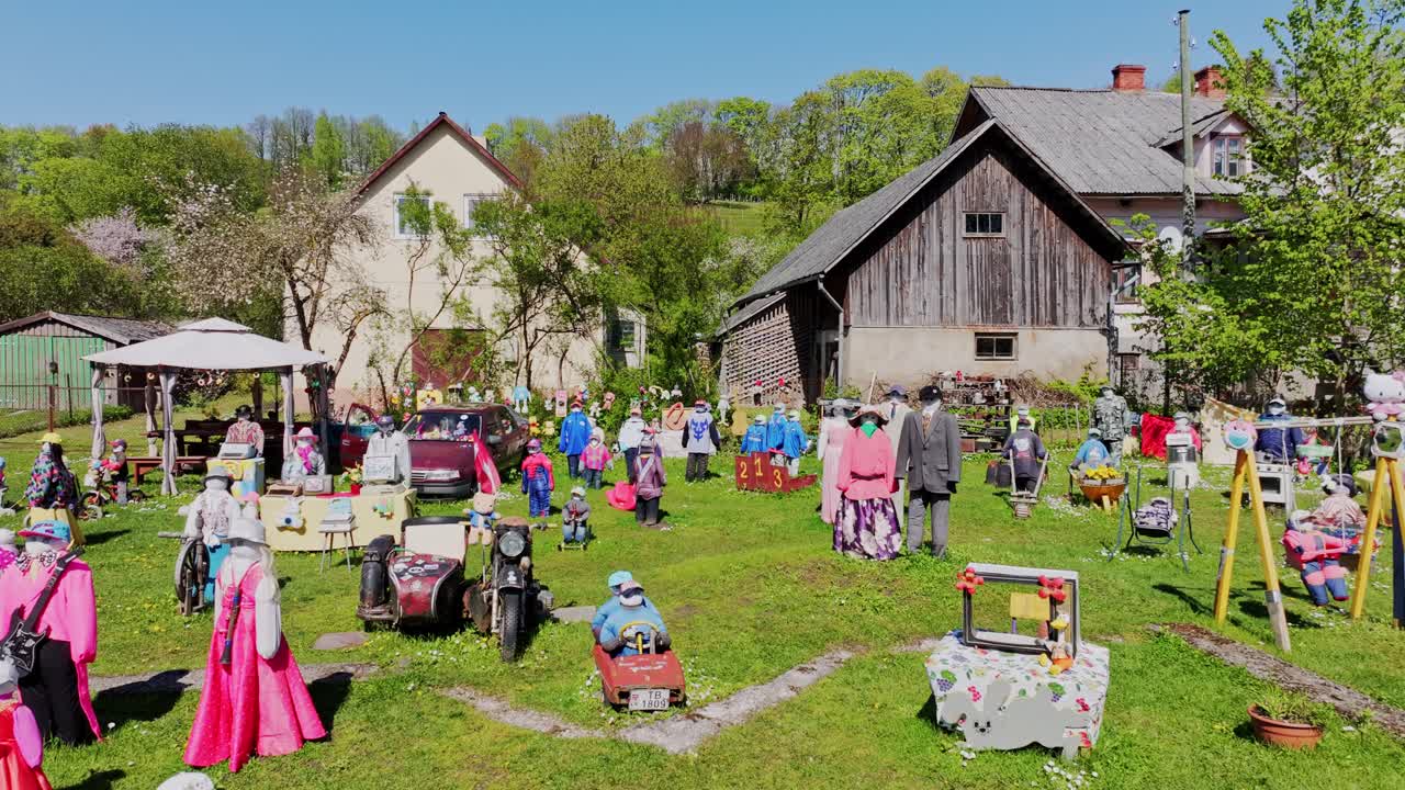 Over 200 dressed straw dolls in Sabile Latvia seen as drone slowly pulls away