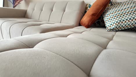 modern sectional sofa with cushions and decorative pillows